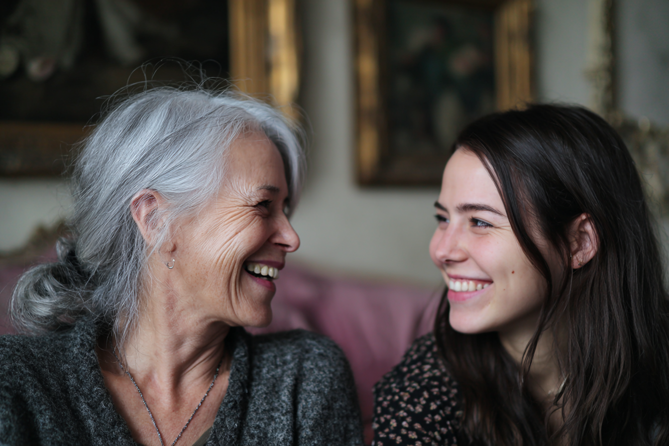 Dos mujeres riéndose juntas | Fuente: Midjourney