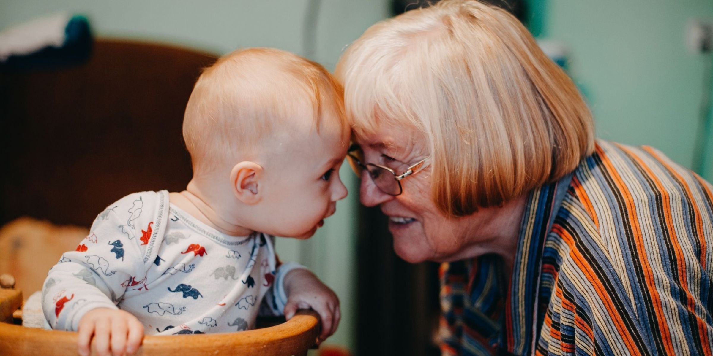 Grandmother sharing a tender moment with a baby | Source: Pexels