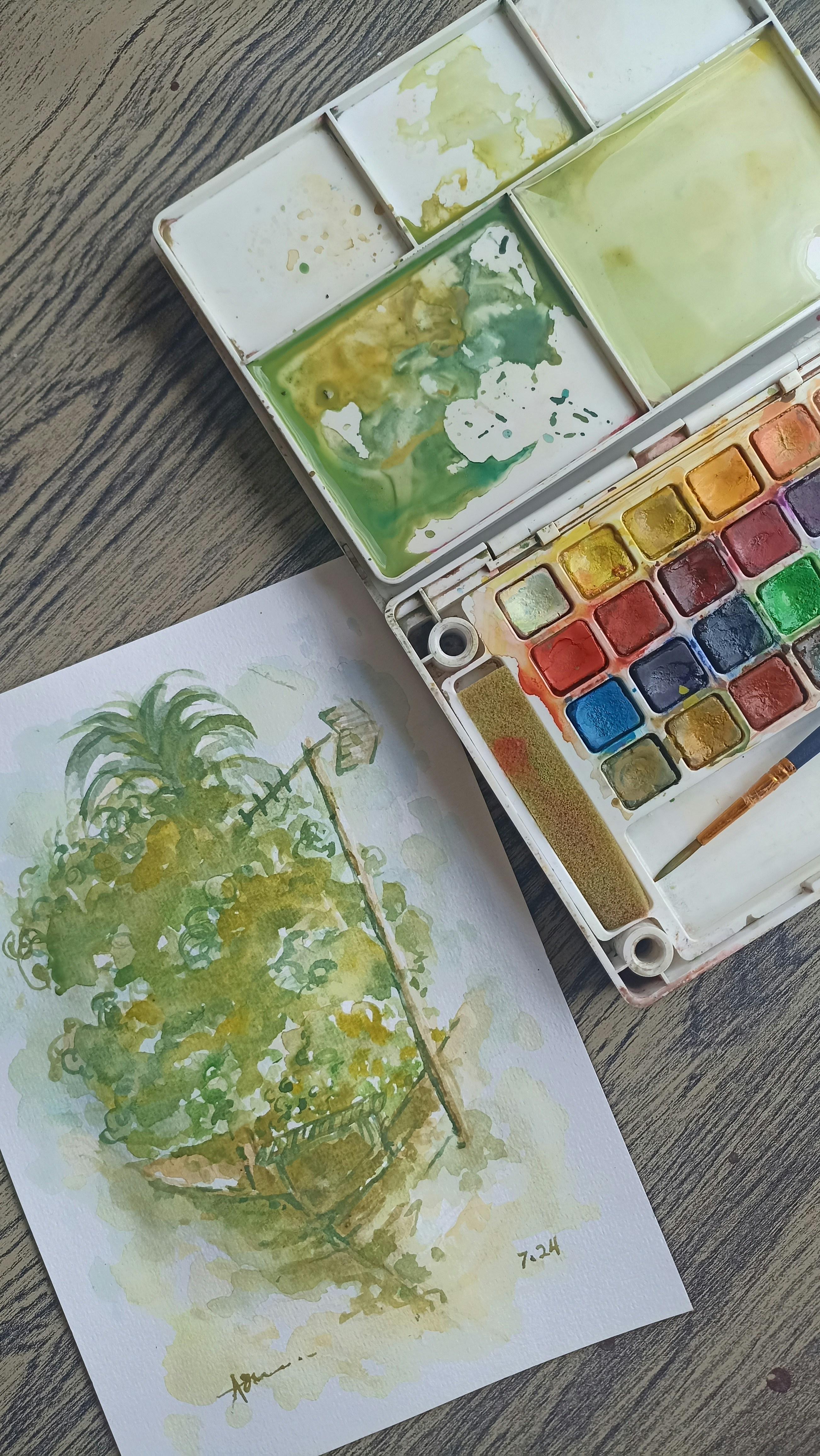 Un juego de pintura de acuarela y una obra de arte | Fuente: Unsplash