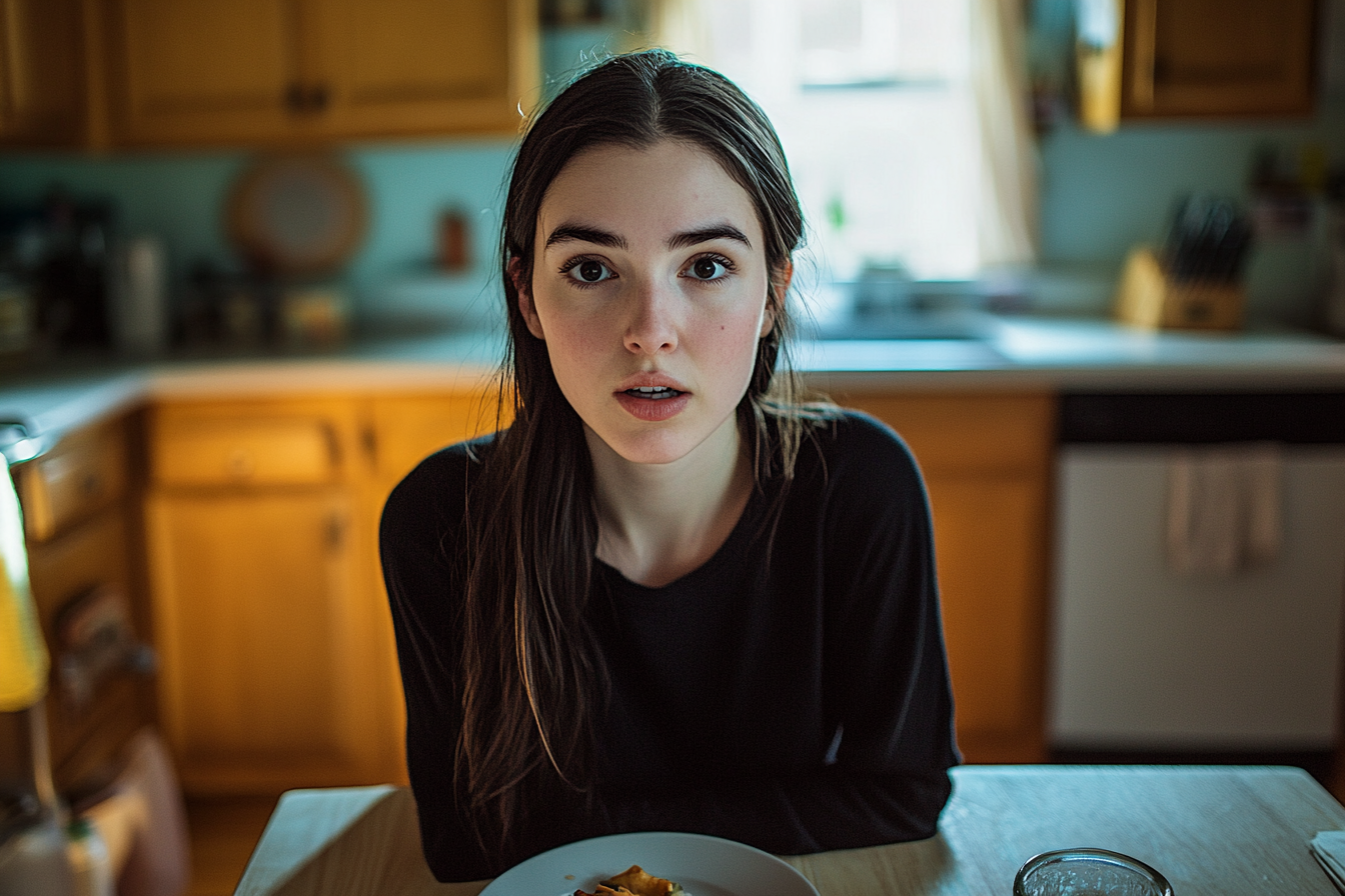 Una joven en una cocina | Fuente: Midjourney